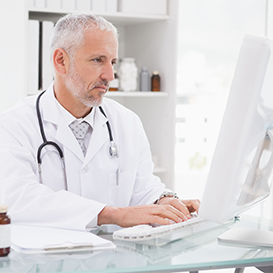 Doctor Looking At Computer